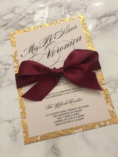 a wedding card with a red bow on it and the words mr and mrs ramon written in spanish