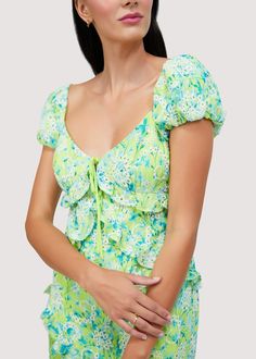 Feel effortlessly chic in our Sunbloom Midi Dress. Designed for all your summer events, this dress is made from a lightweight eyelet chiffon fabric with delicate ruffle details, perfect for those hot summer days. The sweet floral print and refreshing lime green color will add a touch of summer to any occasion. WDWH23235 Imported Lined Self: 100% Polyester Model is 5 ft 9.5 inches; Bust: 32", Waist: 24", Hips: 34" and wearing a size Small Runs true to size Hand wash or wash with gentle cycle with cold water with like colors, Air dry to avoid shrinkage Summer Midi Dress, Midi Dress Summer, Sweet Floral, Summer Events, Swim Accessories, Short Rompers, Chiffon Fabric, The Sweet, Skirt Pants