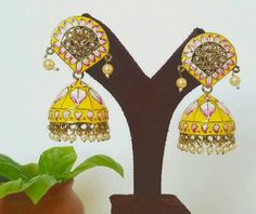 Big Indian Pakistani Jhumka Earrings wedding jewelry  with Hand painted vibrant colors Jhumka in gold plating are beautiful and looks elegant on any occasion will surely galvanize you Indian Jewelry are always a part of all the Indian celebration around the globe . One definitely complete her look once they own it . Beautiful  Indian earrings are plated in gold plating for longer lasting. This artistic Earrings looks beautiful  and elegant perfect for all occasion on any outfits you choose to wear (saree, salwar suits, lenga, etc.) *High quality craftsmanship 100% satisfaction guarantee  *Plated in  Gold plating *Earring Closure push back  on earring  *base metal for earrings is brass * Earring length 6.5cm *Earring width3cm  *package include jhumka earrings  *ready to ship from Houston TX Yellow Latkans Earrings For Wedding, Traditional Yellow Earrings For Wedding, Yellow Meenakari Chandbali Earrings, Festive Yellow Meenakari Earrings, Yellow Meenakari Earrings For Diwali, Yellow Meenakari Chandbali Danglers, Festive Yellow Meenakari Jhumkas, Yellow Meenakari Earrings For Festive Season, Traditional Yellow Jhumkas For Diwali