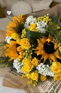 a bouquet of sunflowers and white daisies