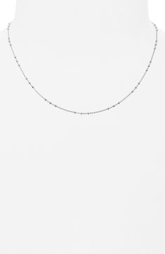 Add sophisticated shine to your layered look with this disc station necklace crafted from sterling silver. Sterling silver Imported Modern Silver Jewelry With Satellite Chain, Classic White Gold Satellite Chain Necklace, White Gold Sterling Silver Necklace For Layering, Classic Silver Station Necklace With Delicate Chain, Silver Satellite Chain Necklace For Everyday, Silver Layered Necklace With Delicate Chain, Silver Clavicle Chain Necklace For Layering, Classic Round Satellite Chain Necklace, Silver Minimalist Satellite Chain Necklace