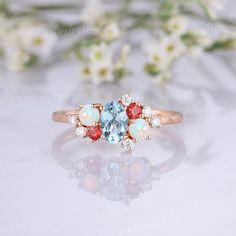 three stone ring sitting on top of a table