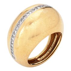 Rare vintage Tiffany & Co diamond dome ring designed by Paloma Picasso, crafted in 18 karat yellow gold & platinum (circa 1980).    33 round brilliant & single cut diamonds total an estimated 0.33 carats (estimated at G-H colour and VS2-SI1 clarity).  Dating to 1980 the 18k gold dome ring, with a central strand of diamonds, is designed by Paloma Picasso for Tiffany & Co, the same year she started her design work at Tiffany (and continues today). Paloma Picasso has a love of big gemstones and bol Tiffany And Co Bracelet, Vintage Tiffany, Paloma Picasso, Bracelet Love, Bold Jewelry, Dome Ring, Tiffany And Co, Domed Ring, Gold Platinum