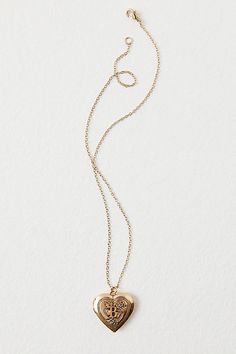 A super sweet gift or an accessory unique to you, this darling monogram necklace features a heart locket pendant with an initial engraving. **Features:** Dainty chain, heart locket pendant, hinge opening mechanism, monogram initial engraving, clasp closure **Why We | Monogram Necklace by Free People in Gold Rose Gold Heart Charm Pendant Locket Necklace, Rose Gold Heart Charm Locket Necklace, Heart Pendant Monogram Jewelry For Anniversary, Elegant Personalized Medallion Heart Necklace, Personalized Medallion Heart Necklace, Silver Dainty Initial Pendant Locket Necklace, Silver Dainty Locket Necklace With Initial Pendant, Dainty Silver Initial Pendant Locket Necklace, Engraved Brass Initial Pendant Jewelry