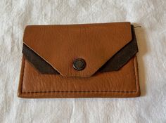 "This is a small, vintage handcrafted coin or change purse. Dates from the 1970s or so. Stamped, \"Genuine Deerskin by Joseph Bruchac, Greenfield Center, N. Y. \" Made of light brown leather with a dark brown center partition, creating 2 compartments. This little coin purse measures 3-3/4\" wide & 2-1/2\" tall. It is flat. It is in very good, vintage condition. No wear, stains or soil. Cute!" Light Brown Leather, Deer Skin, Change Purse, Vintage Purses, Cool Boots, Coin Purses, Purse Pouch, Vintage Tops, Light Brown