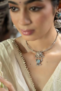 Inspired by the Firoza stone, a symbol of victory, success, and good fortune, the handcrafted Firoza Necklace exudes timeless beauty. Featuring the vibrant Firoza stone as its centerpiece, this necklace is adorned with an intricate Mughal art-inspired motif that brings together tradition and modernity. Designed with an adjustable thread closure for maximum comfort and versatility, it’s perfect for any festive occasion or everyday elegance. Wear the Firoza Necklace to embrace its charm, prosperit Fusion Style Round Pendant Jewelry For Wedding, Fusion Style Round Pendant Wedding Jewelry, Fusion Round Pendant Wedding Jewelry, Fusion Style Round Pendant For Wedding, Spiritual Gemstone Necklaces For Celebration, Festive Bridal Pendant Necklace, Fusion Style Necklaces With Stone Setting, Temple Jewelry Necklace With Round Gemstone Pendant, Temple Jewelry Gemstone Round Pendant Necklace