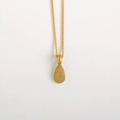 This Egg Shaped Pendant is made of 22k Solid Gold and it is a part from our 'Middle Line' collection. Metal: 22k yellow solid goldGold pendant length: approx. 10 mm (0.4") | width: 6.5 mm (2.5'').Inner diameter of the link: approx. 3 mm. We can make it larger at your request.We chose to use 22 karat gold for our weight pendants, for their high density. It's a small, concentrated pendant, a small object with a satisfying weight to it, keeping it centered on its chain.Whether around the neck, clos Gold Plated Yellow Gold Drop Necklace Gift, Gold Plated Yellow Gold Drop Necklace As Gift, Yellow Gold Plated Drop Necklace As A Gift, Gold Plated Teardrop Drop Necklace, Gold Teardrop Hammered Necklace, Yellow Gold Teardrop Drop Necklace For Gift, Gold Drop Necklace For Gift, Gold Teardrop Drop Necklace For Gift, Minimalist 22k Gold Jewelry For Gift