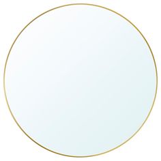 a round mirror with a gold rim on a white background