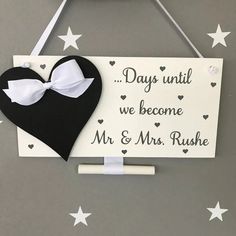 a sign that says days until we become mr and mrs rushe hanging on the wall