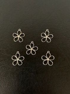 5 silver tone double sided open design flower charms, silver flower charm, open flower pendant, open flower charms, wire flower charms, 5 petal flower charm, charm flower ★ Charm Size: 3/4" L X 5/8" W.          ★ More charms, beads, pendants, jewelry making supplies and buttons available at https://www.etsy.com/shop/ElevenWestDesigns 4 5 Petal Flower, Open Flower, Wire Flowers, Petal Flower, Design Flower, Open Design, Flower Charm, Silver Flowers, Flower Pendant