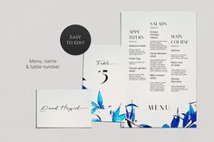 an image of menus and place cards with blue flowers on them, set against a white background