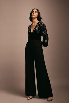 Style: JumpsuitFabric: VelvetLength: RegularNeckline: V NeckSleeve Length: Long Sleeve Prom Jumpsuits Women, Party Jumpsuits For Women, Jumpsuit Soiree, Diwali Party Outfit, Black Tie Jumpsuit, Party Wear Jumpsuit, Officiant Attire, Formal Party Outfit, Evening Wear Jumpsuits