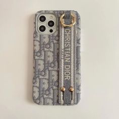 an iphone case with a keychain attached to the front and back of it