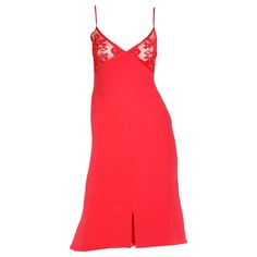 This stunning vintage Valentino red slip dress is in a beautiful, luxe silk crepe with a lace bustline and spaghetti straps. The dress is fully lined below the bust and we especially love the cutouts at the hemline that have lace inserts underneath. Please look at the measurements carefully because this dress fits more like a modern day US size 4 or a size 6 with narrow hips. The lace bra portion snaps in the back and there is a zipper that starts at the waist. The back of the dress has a unique V-neck Slip Dress With Delicate Lace For Party, Sleeveless Evening Slip Dress With Delicate Lace, Evening Silk Slip Dress With Delicate Lace, Silk Evening Slip Dress With Delicate Lace, Elegant Slip Dress With Delicate Lace For Night Out, Lace Camisole Slip Dress For Evening, Party Slip Dress With Spaghetti Straps And Delicate Lace, Elegant Red Camisole Slip Dress, Evening Dresses With Lace Bodice Camisole