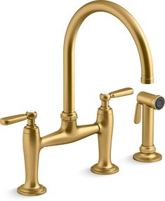 a golden faucet with two handles