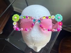 Add a little fun to any outfit with these flowery sunglasses. Fun Multicolor Festival Sunglasses, Fun Multicolor Sunglasses For Festivals, Playful Multicolor Party Sunglasses, Playful Multicolor Sunglasses For Spring, Fun Multicolor Spring Sunglasses, Fun Multicolor Sunglasses For Spring, Fun Multicolor Summer Sunglasses, Fun Multicolor Sunglasses For Summer, Playful Beach Sunglasses For Spring