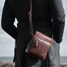 Experience the perfect blend of style, functionality, and craftsmanship with our exquisite Man Bag. This crossbody bag purse for men, intricately engraved on genuine brown leather, is a timeless piece that evokes a sense of sophistication and elegance. With its compact size of 21 x 15.5 x 6 cm, this bag is designed to hold all your essentials without compromising on style. It's not just a bag; it's a statement of taste and personality, making it an ideal Christmas gift or a special treat for you Sling Bag Leather, Handmade Gift For Him, Handmade Gifts For Him, Mens Crossbody Bag, Personalised Gifts Handmade, Small Leather Bag, Man Purse, Leather Man, Personalised Gifts For Him