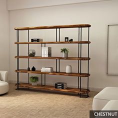 a living room filled with furniture and a book shelf next to a white couch on top of a hard wood floor