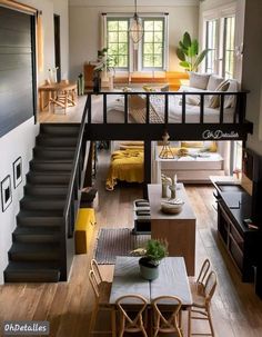 a living room filled with furniture and stairs