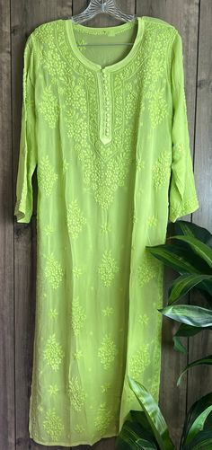 "Trendy \"ghaas patti \" Chikankari green kurta on fine flowy georgette. Beautifully hand embroidered! Liner included. Kurti length-49 inches \"Embroidery designs may slightly vary \"" Luxury Chikankari Embroidered Dupatta For Spring, Luxury Chikankari Embroidered Tops For Party, Light Green Kurti Design, Green Resham Embroidered Georgette Kurta, Green Georgette Kurta With Dabka Work, Green Kurta With Chikankari Embroidery In Georgette, Green Embroidered Kurta For Diwali, Green Anarkali Kurta For Summer, Green Straight Kurta With Intricate Embroidery