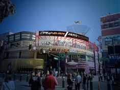 an artist's rendering of the exterior of a stadium with people walking around it