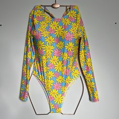 Shein Xs Pink, Blue And Yellow Floral One Piece Swimsuit With Long Sleeves Nwot Has Sanitary Liner Yellow Long Sleeve Swimwear For Spring, Trendy Neon Yellow Swimwear For Spring, Neon Yellow Stretch Swimwear For Spring, Beach Season Blue Long Sleeve Bodysuit, Spring Multicolor Bodysuit For Poolside, Blue Long Sleeve Bodysuit For Beach Season, Stretch Bodysuit For Spring Beachwear, Long Sleeve Blue Bodysuit For Beach Season, Yellow One-piece Bodysuit For Swimming