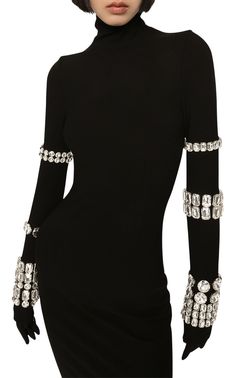 Dolce&Gabbana's collaboration with Kim Kardashian sees classic silhouettes receive an elevated refresh. This turtleneck midi dress is made from figure-hugging stretch-knit and embellished with crystal-studded bracelets along the exaggerated sleeves.Stretch-designRhinestone embellishmentHigh neckLong sleevesStraight hemClosure: zipped backComposition: Viscose 75%, Polyamide 17%, Spandex/Elastane 8%Embroidery: 30% brass, 70% glassMade in Italy Kim Kardashian Black Dress, Black Embellished Dress, Turtleneck Midi Dress, Exaggerated Sleeves, International Clothing, Dolce Gabbana Dress, Muslimah Fashion Outfits, Luxury Women Fashion