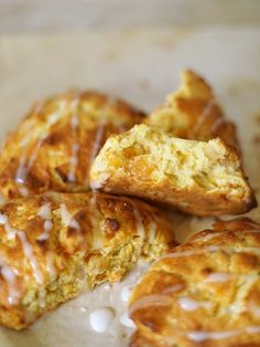 several pastries with icing sitting on top of each other