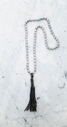 "Silver Baroque Pearl & Chic Grey Tassel Stylish Baroque Pearl Necklace with Leather Tassel in elegant boho style. The choice of your preferred color available. \"Must Have\" necklace! Size of Baroque Pearls: Approx. 1/4\"-2/5\" (0.7cm-1cm) Length of Pearl Necklace: Approx. 45\" (115cm) Length of Tassel: Approx. 6\"(16cm)" Elegant Lariat Necklaces Hand Knotted, Elegant Hand-knotted Lariat Necklaces, Bohemian Silver Hand Knotted Jewelry, Elegant Silver Hand-knotted Necklace, Elegant Silver Hand Knotted Necklace, Elegant Hand Knotted Silver Necklace, Elegant Hand Knotted Silver Jewelry, Elegant Hand-knotted Silver Jewelry, Silver Bohemian Jewelry