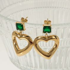 Product Name - Handmade Stainless Steel Gold Plated Irregular Heart Zircon Dangling Earrings With Green Emerald Stone Material - Stainless Steel, Gold Plated Uses & Purpose - Fashion Earring, Gift Size - 5MM Care Instruction - Handle With Care Earring Gift, Stone Material, Emerald Stone, Dangling Earrings, Green Emerald, Emerald Green, Fashion Earrings, Jewelry Earrings Dangle, For Girls