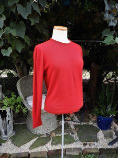 "Vtg 1970's Red Ladies Sweater|Vtg Red Retro Acrlic LS Crew Sweater|Vtg Designers Original Red Sweater sz M/38 This is a great vintage 1970's bright red acrylic sweater by Designers Original.  It is 100% acrylic and so easy to care for being machine washable.  This sweater is in great condition with a light show of wear and the button loop in the back in need of repair which I will do prior to shipping. I love the bright red cheerful color and true vintage look.  A great basic for your wardrobe, Retro Red Tops For Winter, Red Retro Winter Tops, Fitted Red Crew Neck Sweater, Vintage Red Top For Winter, Vintage Red Tops For Winter, Red Vintage Tops For Fall, Classic Red Crew Neck Sweater, Vintage Red Fall Sweater, Classic Red Sweater For Fall