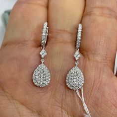 "Beautiful Diamond Drop Earrings set with white and sparkling diamonds.  Excellent craftsmanship, all diamonds set smooth with minimal prongs showing.  The diamonds are clustered together to give the look of one solitaire diamond.  The earrings measures about 30.5mm long (1.2\" long).  The strong push backings snaps in tight for a secure fit.  You can dance the night away in these beautiful earrings!  Classy earrings to last a lifetime.   Genuine natural round brilliant cut diamonds total weight: 0.79 carats Clarity: SI Color: F/G All white and shiny diamonds, no cloudy or yellowish stones  18K White Gold Earring 3.5 grams  Comes with gift box * We have been in the wholesale Jewelry business for over 30 years serving the community at the same location.  All diamonds we use are natural ston Bridal Earrings With Pave Setting In Diamond White, Pear-shaped Diamond Cut White Gold Earrings, Pear-shaped White Diamond Earrings, Dazzling Dangle Diamond Earrings With Pave Setting, Diamond Drop Earrings With Pave Setting, Vvs Clarity Drop Diamond Earrings For Formal Events, Diamond White Brilliant Cut Pear-shaped Earrings, Pear-shaped Diamond White Diamond Earrings, Pear-shaped Diamond Cut Diamond Earrings