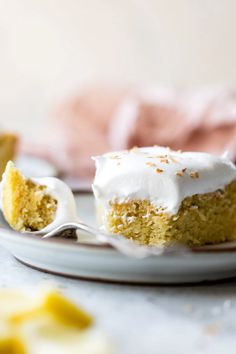 a piece of cake sitting on top of a white plate with a bite taken out of it