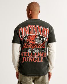 Showcase your team spirit with the Abercrombie & Fitch Men's Cincinnati Bengals Graphic Tee. This black textured shirt is designed for the ultimate fan, featuring bold graphics on both the chest and back that celebrate your favorite NFL team.

- Size: XL
- Color: Black Texture
- Material: Cotton
- Gender: Male
- Age Group: Adult
- Features: Short sleeves, crew neckline, relaxed-fit silhouette

Crafted from A&F's signature softAF fabric, this tee offers both supreme comfort and durable wear, maki Fall Crew Neck T-shirt With Back Print, Sporty Washed Black T-shirt With Graphic Print, Casual T-shirt With Back Print For Fall, Collegiate Relaxed Fit Graphic T-shirt, Collegiate Style Graphic T-shirt For Fall, Game Day Relaxed Fit Graphic T-shirt, Relaxed Fit Game Day Graphic T-shirt, Washed Black Crew Neck T-shirt For Fall, Black Relaxed Fit T-shirt For Game Day