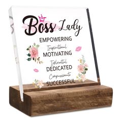 a wooden plaque with the words boss lady on it