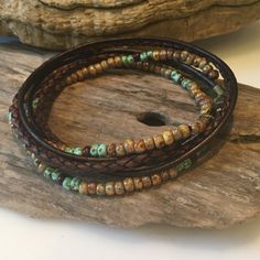 This stunning Boho wrap is made with all natural, genuine materials! Genuine Antique Brown braided leather with high quality Miyuki seed beads in colors of Beige, Brown and seafoam green! This is made to wrap around your wrist twice and encloses with a lobster clasp. **If you are purchasing more than one bracelet, please specify in the note area the size wanted for each bracelet. Thanks! You can have one made for her and him! Your beaded wrap will come packaged in a gorgeous gift bag and box! Si Beaded Brown Wrap Bracelet For The Beach, Beaded Brown Wrap Bracelet For Beach, Brown Beaded Wrap Bracelet For Beach, Handmade Spiritual Leather Bracelet With Round Beads, Festival Hand Wrapped Wrap Bracelet, Hippie Beaded Wrap Bracelet With Round Beads, Bohemian Hand-strung Bracelets With Waxed Cord, Hand Wrapped Waxed Cord Bracelets With Round Beads, Artisan Hand Wrapped Wrap Bracelet With Round Beads