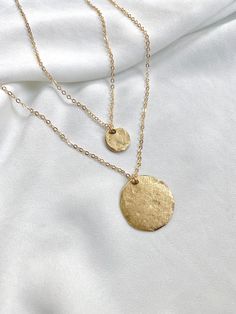 Choice of Small or Large Minimalist Gold Hammered Coin Medallion Necklace --- International Buyers: Please be familiar with your country's policies in regards to customs fees prior to purchasing overseas. Any fees/taxes are the buyer's responsibility and may be charged at the time of delivery/pick-up. This is not included in the costs here. Thank you! Gold Coin Necklaces are classic and timeless. These pieces are no exception. Select your choice of Large or Small (or both) Coin Necklace(s) at ch Adjustable Round Pendant Necklace, Cadmium-free, Adjustable Round Pendant Necklace Cadmium-free, Cadmium-free Adjustable Round Pendant Necklace, Adjustable Gold Coin Necklace, Minimalist Cadmium-free Round Necklace, Gold Clavicle Chain Necklace With Round Disc, Handmade Gold Round Disc Jewelry, Gold Hammered Round Necklace, Gold Hammered Round Necklaces