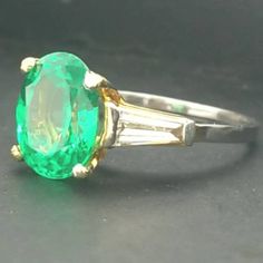 Gorgeous classic elegant platinum 18k yellow gold ring gem green tsavorite Center gem lab grown green tsavorite in oval shape weight 3.78ct. Size 10x8mm very nice rich green color nice luster lively,nice green color,clean side two natural diamonds total weight 0.25ct. H-SI1 ring size 5 Resizable Retail value $6,500 net. Appraisal available Classic Pear-shaped Green Ring, Classic Green Pear-shaped Ring, Oval Tsavorite White Gold Ring, Oval Tsavorite Ring In White Gold, Oval Tsavorite Ring With Center Stone, Classic Oval Tsavorite Emerald Ring, Gia Certified Oval Emerald Ring In Yellow Gold, Classic Yellow Gold Tsavorite Emerald Ring, Classic Yellow Gold Tsavorite Ring