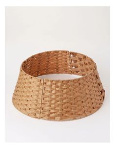 a close up of a woven basket on a white background