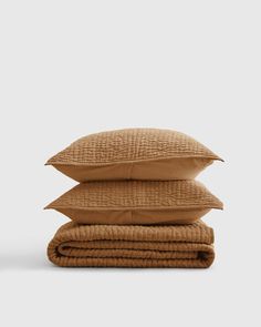 three pillows stacked on top of each other