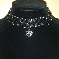 Thick Tattoo Choker Style Necklace With Beads Heart Charm Handmade With Love Stretch To Fit Perfect For Valentines Day Same Day Or Next Day Shipping Please Feel Free To Ask For Any Details/ Measurements Everything I List Is Cross Posted On Other Platforms, Snag It Before It's Gone Stay Blessed, Stay Safe. Shopsaritalynne Black Heart Charm Choker For Valentine's Day, Black Heart-shaped Metal Choker, Black Metal Choker For Valentine's Day, Elegant Black Heart Pendant Choker, Elegant Black Heart-shaped Choker, Elegant Black Valentine's Day Choker, Black Heart Pendant Choker With Heart Charm, Black Heart Pendant Choker With Charm, Heart Beads Party Choker