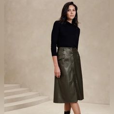 -Vegan Leather Skirt, Size S, In Olive Green Color -Lightweight, Smooth And Soft -Button Front Closure -Belt Loops -Front Pockets -Waist Darts - High Waist -Full Hem -Fully Lined -Base Fabric: 100% Rayon -Outer Coating:Polyruethane Hunter Green Leather Skirt, A Line Leather Skirt Outfit, Green Leather Skirt Outfit, Midi Leather Skirt Outfit, Outfit With Leather Skirt, Leather Midi Skirt Outfit, Midi Leather Skirt, Green Leather Skirt, A Line Skirt Outfits