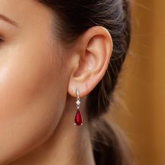 Rubellites are part of the tourmaline family that boasts a vivid fuchsia red color. Filled with a rich bougainvillea purplish red that comes alive thanks to the gems flawless cut, this pair of cascading Rubellite earrings will surely bring a smile to her face. Eye clean and surrounded by sparkling diamonds, there won’t be any outfit these rubellites cannot flatter. Luxury Red Brilliant Cut Earrings, Formal Red Diamond Earrings, Formal Red Diamond Earrings With Brilliant Cut, Exquisite Red Formal Earrings, Red Brilliant Cut Fine Jewelry Earrings, Exquisite Red Earrings For Formal Occasions, Red Diamond Earrings For Formal Occasions, Fine Jewelry Red Diamond Earrings For Formal Occasions, Exquisite Red Ruby Earrings