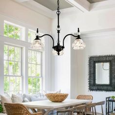 a dining room table with chairs and a bowl on it