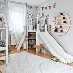 a child's bedroom with a slide and bunk bed