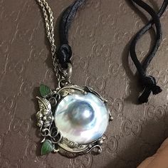 Sb C.’60-‘70s Rare!! Vintage Beautiful Vintage Big Pearl In Blue M.Of Pearl With Silver Flower/Leaf Design Frame With Green Jade. 925 Marked Inside Of The Bail. Has Beautiful Patina 2mm / 18” 925 Marked Vintage Silver Rope Chain. It Needs To Be Cleaned Really Beautiful In Person Even With Patina! Has Extra 30” Satin String Item Comes In Regular Pouch Or Box I Don't Polish Item & Just Send As Is. You Can Polish Whenever You Wish Price Is Firm Item Only (Unless I Mention Abt Packaging Or Tag) But Vintage Silver Pearl Necklace For Evening, Vintage Silver Jewelry With Pearl Charm, Vintage Silver Pearl Necklace For Formal Occasions, Silver Vintage Pearl Necklace For Formal Occasions, Vintage Silver Pearl Necklaces, Vintage Silver Necklace With Pearl Pendant, Vintage Silver Pearl Necklace With Pendant, Vintage Sterling Silver Necklace With Pearl Pendant, Vintage Round Mother Of Pearl Necklace