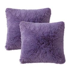 two purple pillows sitting next to each other