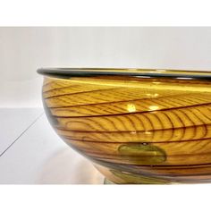 a wooden bowl sitting on top of a table