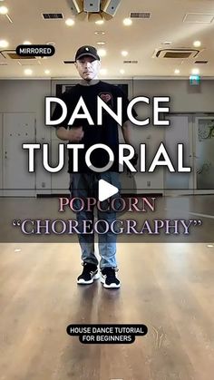 a man standing on top of a hard wood floor in front of a dance studio