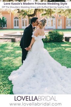 a bride and groom posing for a photo in front of a building